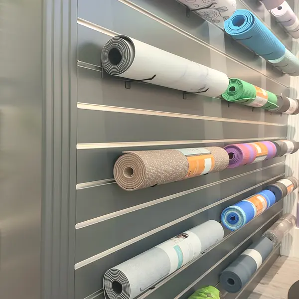 Custom yoga mat rolls displayed in multiple colors and designs